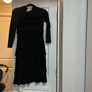 Gorgeous classics black dress with ruffles and mock neck